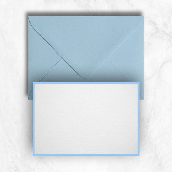 Azure blue borders printed onto a white card with matching blue envelopes