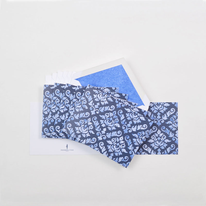 the blue damask pattern greeting cards shown fanned out with matching tissue paper lined envelopes