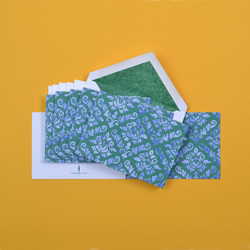 the blue green damask pattern greeting cards shown fanned out with matching tissue paper lined envelopes