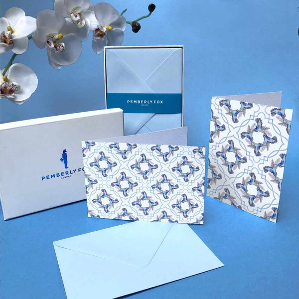The blue hummingbird greeting cards are folded, blank on the inside and come with matching blue envelopes