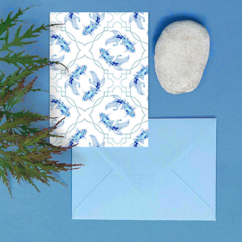 The blue koi carp card, face down, showing the diamond flapped matching light blue envelope