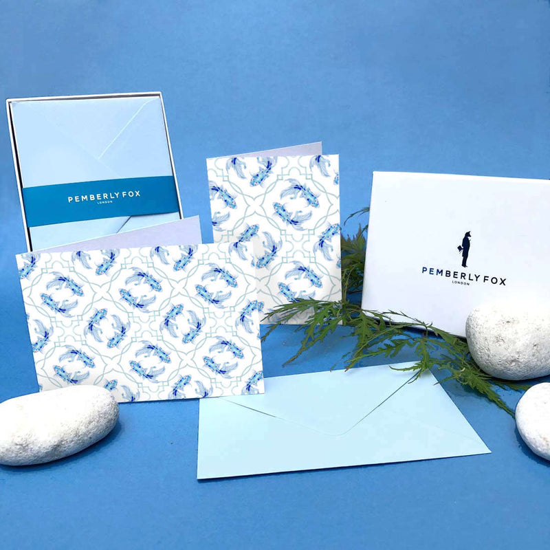 The blue koi carp greeting cards are folded, blank on the inside and come with matching blue envelopes