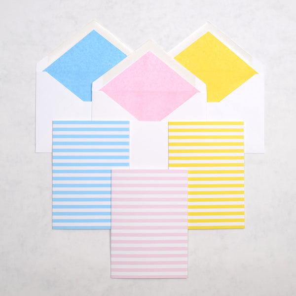 the brighton rock stripe pattern greeting cards show horizontal stripes on portrait cards, with matching tissue paper lined white envelopes