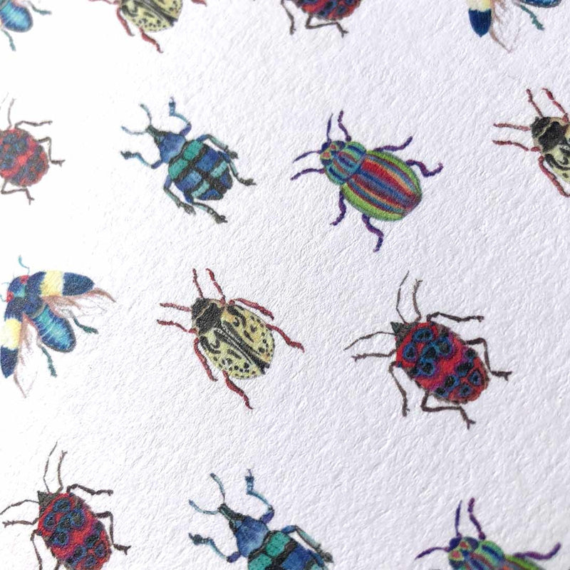 A close up shot of the butopia pattern, showing lots of brightly drawn bugs