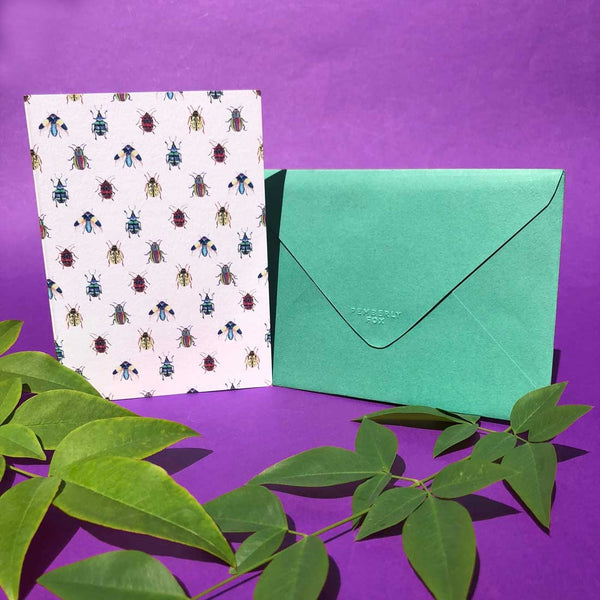 The Portrait bugtopia card, with the fold on the long side with it's emerald green envelope