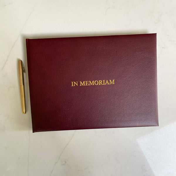 Our burgundy leather bound condolence book, embossed with gold