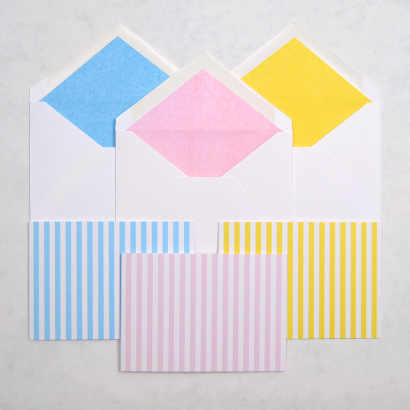 the Candy stripe pattern greeting cards show vertical stripes on landscape cards, with matching tissue paper lined white envelopes
