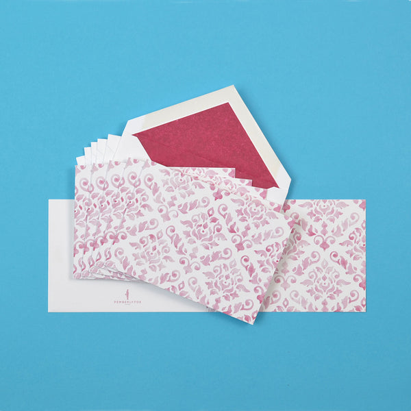 the claret damask pattern greeting cards shown fanned out with matching tissue paper lined envelopes