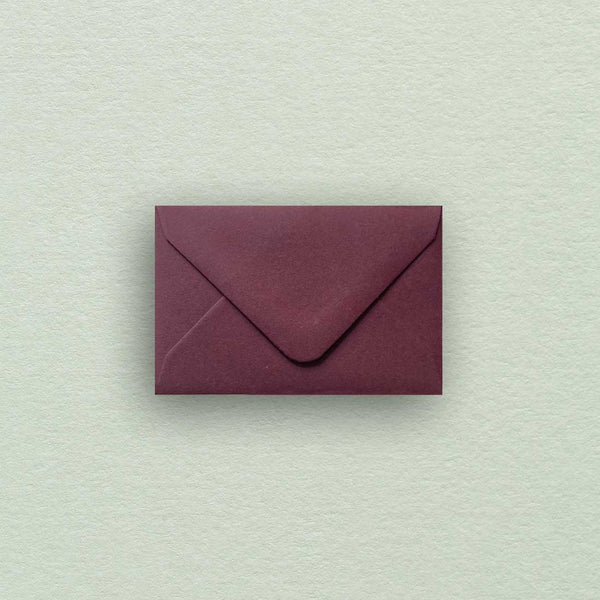 These deep burgundy mini envelopes come with diamond flaps 