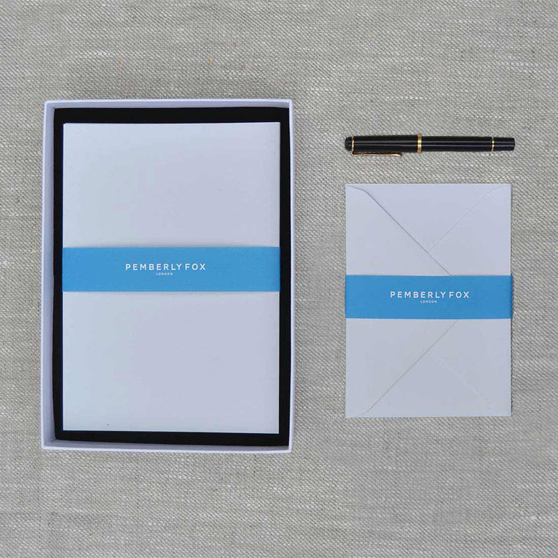 The cool grey a5 writing paper and envelopes are are a very light grey and sold in a branded Pemberly Fox box.
