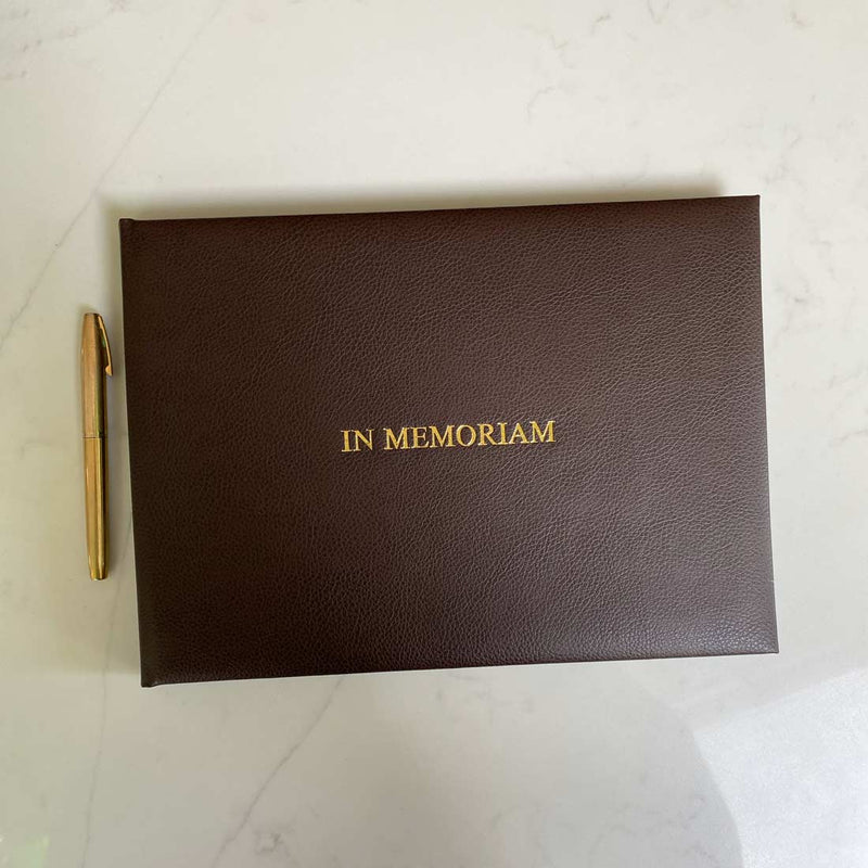 The leather used for this condolence book is a deep shade of brown and contrasts well with the gold embossed word