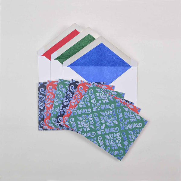 the dark shades of damask pattern greeting cards shown fanned out with matching tissue paper lined envelopes