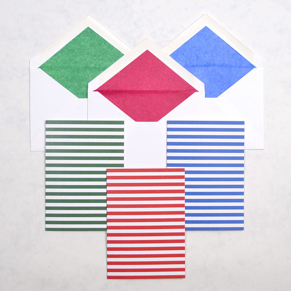 the fiesta stripe pattern greeting cards show horizontal stripes on portrait cards, with matching tissue paper lined white envelopes