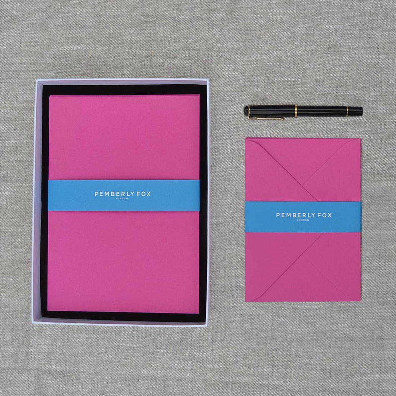 The fuchsia pink a5 writing paper and envelopes are shocking pink and sold in a branded Pemberly Fox box.
