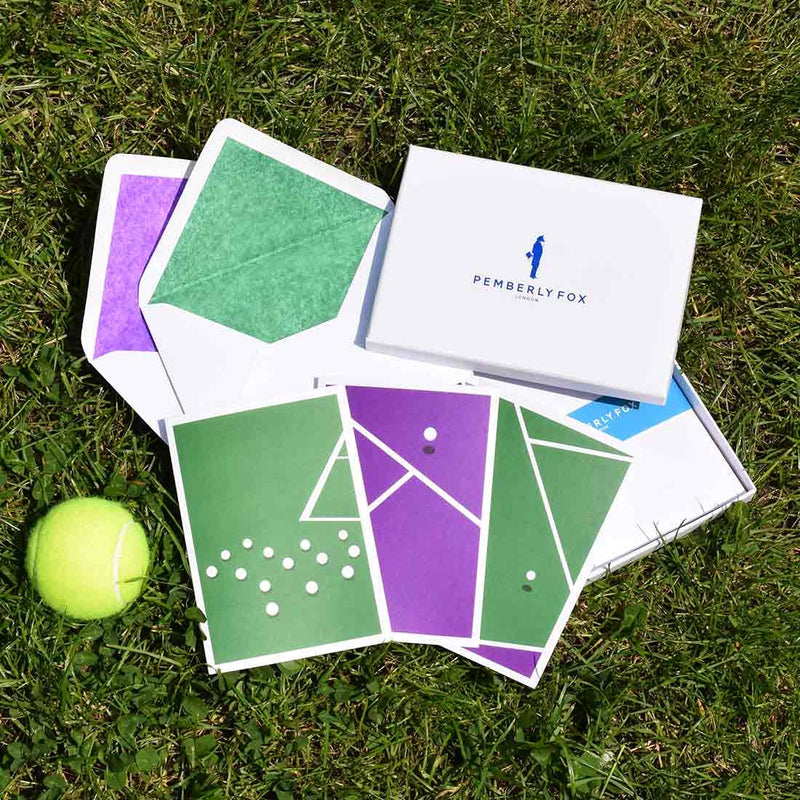 the game set and match greeting cards show a modern representation take on tennis using Wimbledon's trademark colours, with purple and green tissue paper lined white envelopes