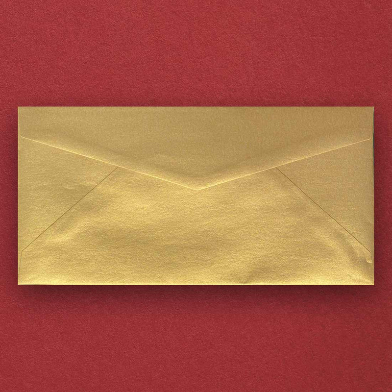a shimmering gold dl envelope with a diamond flap