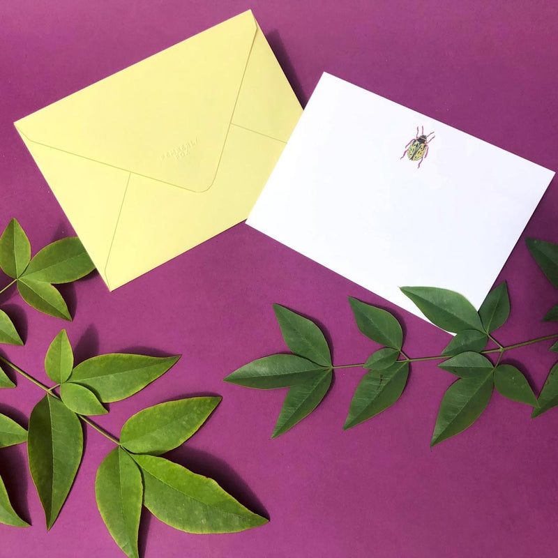 The Leopard bug note card shows a single motif sketch at the head and comes with sorbet yellow envelopes 