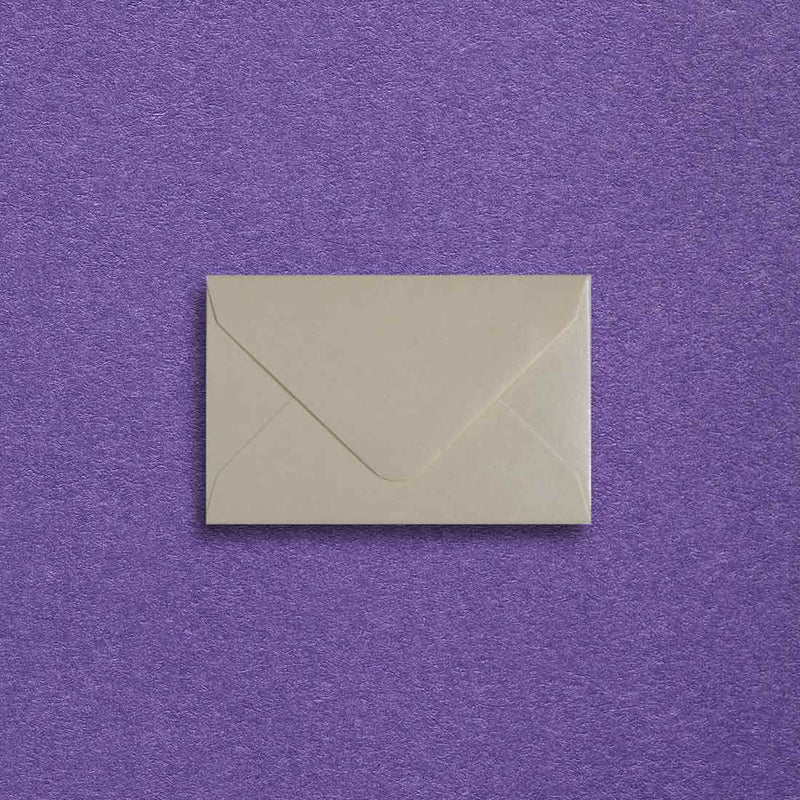 A diamond flapped mini cream envelope, made with a pearlescent shiny paper