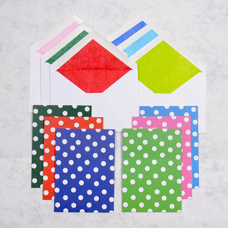 the polka set greeting cards show 6 colour ways of a polka dot pattern on portrait cards, with matching tissue paper lined white envelopes