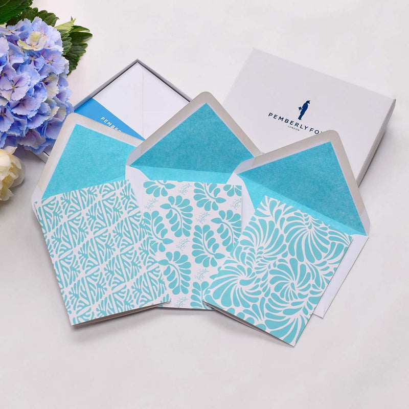the sian ka'an greeting cards shows the a foliage pattern repeated in turquoise blue with matching colour tissue lined envelopes