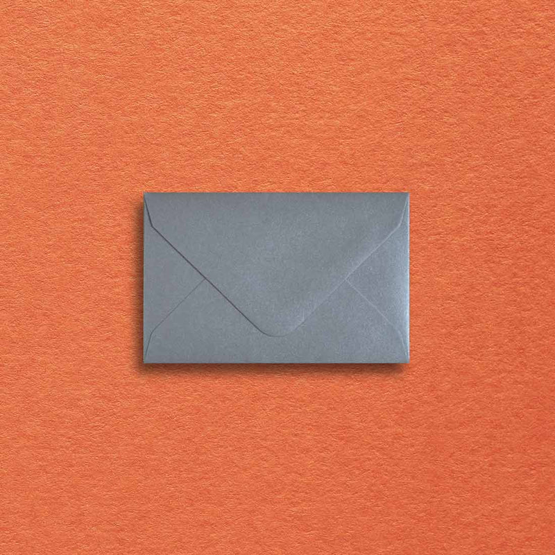 a pearlescent silver paper is used to make these mini envelopes with a diamond flap