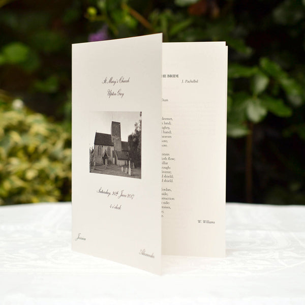 The Tilney Wedding order of service bears a photo of the church printed onto the front cover of an off-white booklet