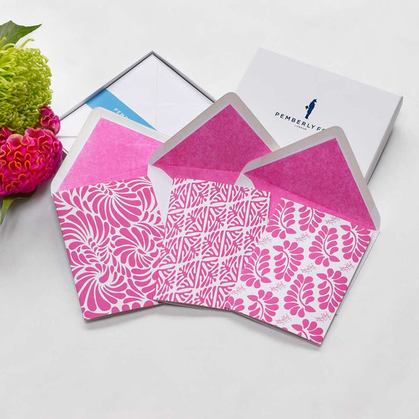 the tzotzil greeting cards shows three tropical leaf patterns common in local mexican clothing repeated in bright pink with matching colour tissue lined envelopes