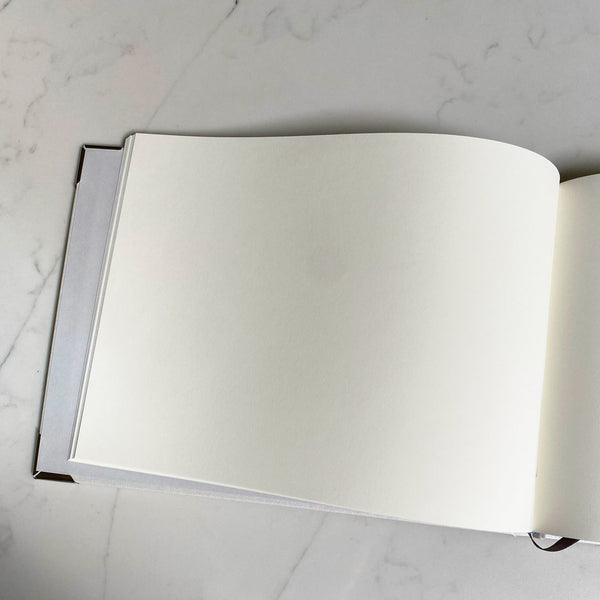 Plain pages are contained within the wedding guest book for your guests to write on